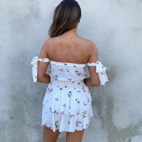 White Romper Dress with ruffle skirt, self tie straps, and floral embroidery. - Picture 3 of 6